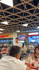 Inside a upscale Tashkent mall with a Ferrari on the floor