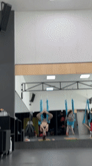 Aerial yoga class captured at fitness studio