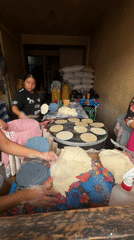 Woman makes tortillas at cooking station in Chilpancingo
