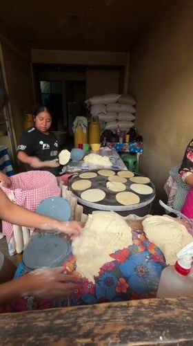 Woman makes tortillas at cooking station in Chilpancingo