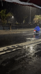 Heavy rain floods streets, collapses umbrellas in Kuta