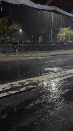 Heavy rain floods streets, collapses umbrellas in Kuta