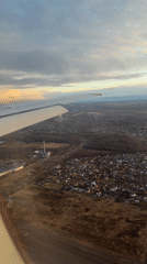 Aerial view shows residential to urban landscape transition