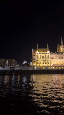 Budapest's Parliament Building glowing after dark along the Danube