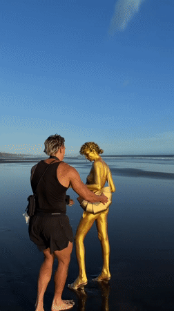 Beach photography session with golden body paint in Kerambitan