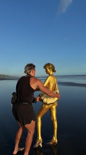 Beach photography session with golden body paint in Kerambitan