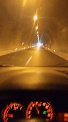 Driver's-eye view through an artificially lit tunnel