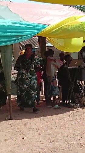 Community celebration held under decorated tent in Goni Gara