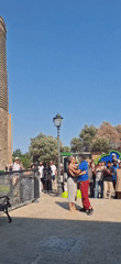 Live music and dancing near a historic tower in Baku