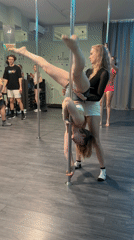 Women attend pole dancing class in Batumi fitness studio