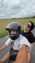 Couple spotted riding scooter in Kediri, Indonesia