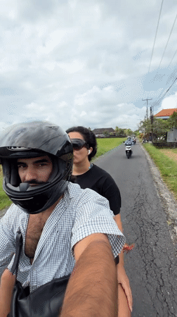 Couple spotted riding scooter in Kediri, Indonesia