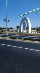 Ornate circular monument with Uzbekistan flags in Tashkent
