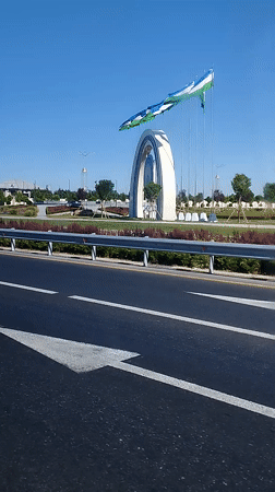 Ornate circular monument with Uzbekistan flags in Tashkent