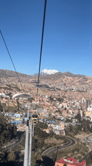 Cable car rider films aerial view of La Paz