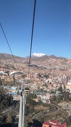 Cable car rider films aerial view of La Paz