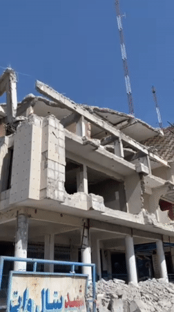 Extensive building damage documented in Kandahar amid street activity