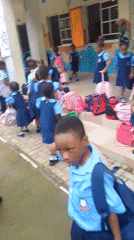 School children in uniforms gathered at Idimu facility