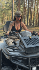 Woman photographed on ATV in Russian forest near Kozino