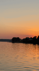 Sunset documented over Votkinsk waterfront by multiple witnesses