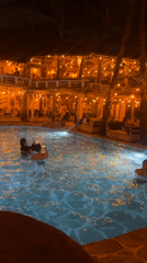 Nighttime dining and swimming captured at North Kuta resort venue