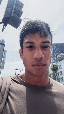 Young man films video on Hollywood Walk of Fame