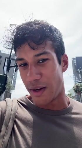 Young man films video on Hollywood Walk of Fame