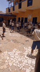 School children gather at Badiko educational facility during midday