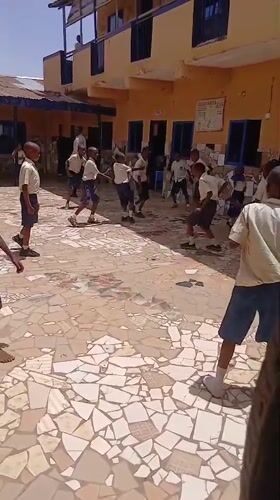 School children gather at Badiko educational facility during midday