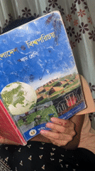 Student holds Bangladesh studies textbook in Hizla
