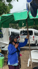 Patong Beach morning scene with chairs, umbrellas, families