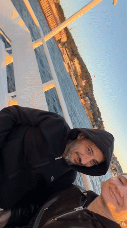 Couple takes sunset selfie on Bosphorus boat near Istanbul