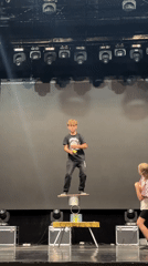 Stage circus performance with juggling, balance acts, and acrobatics