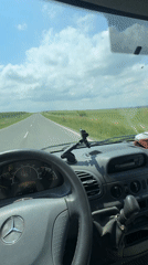 Driver travels two-lane road in Mercedes van near Madara