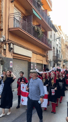 Multinational folk parade through the streets of Calella, Spain