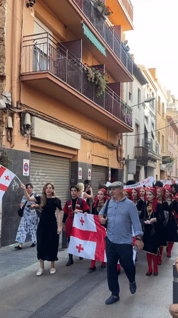 Multinational folk parade through the streets of Calella, Spain
