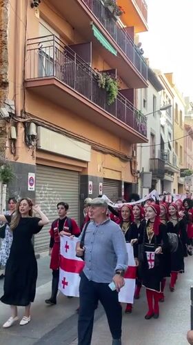 Multinational folk parade through the streets of Calella, Spain