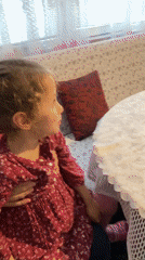 Woman and child share meal with chocolate cake at home