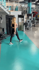 Woman exercises at modern gym in Yekaterinburg, Russia