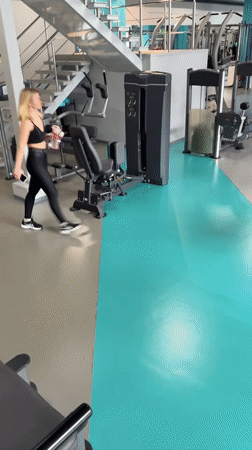 Woman exercises at modern gym in Yekaterinburg, Russia