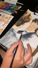 Watercolor portrait in progress at a Sochi workspace