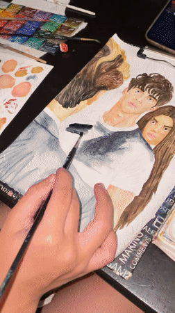 Watercolor portrait in progress at a Sochi workspace