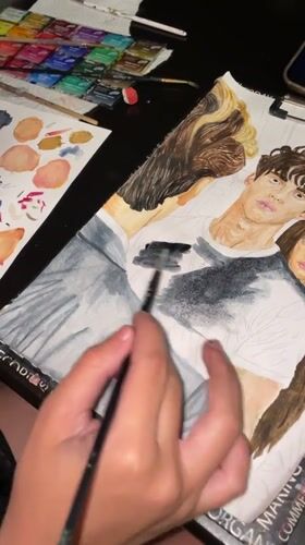 Watercolor portrait in progress at a Sochi workspace
