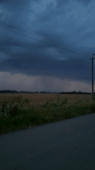Stormy skies over harvested farmland near Gorkovskiy, Russia