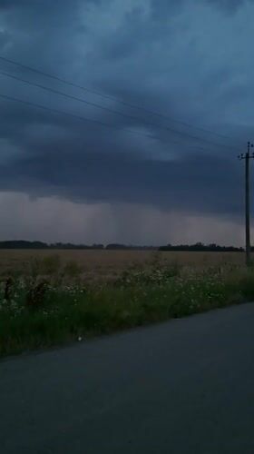 Stormy skies over harvested farmland near Gorkovskiy, Russia
