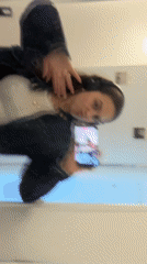 Woman takes mirror selfies with Pokémon phone case in Milan