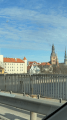 Daytime cityscape of Riga captured from moving vehicle