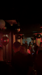 Nightclub patrons dance under disco lights in Targovishte, Bulgaria