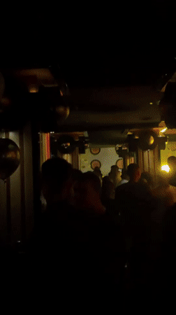 Nightclub patrons dance under disco lights in Targovishte, Bulgaria