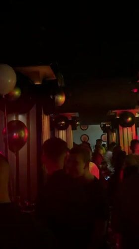 Nightclub patrons dance under disco lights in Targovishte, Bulgaria